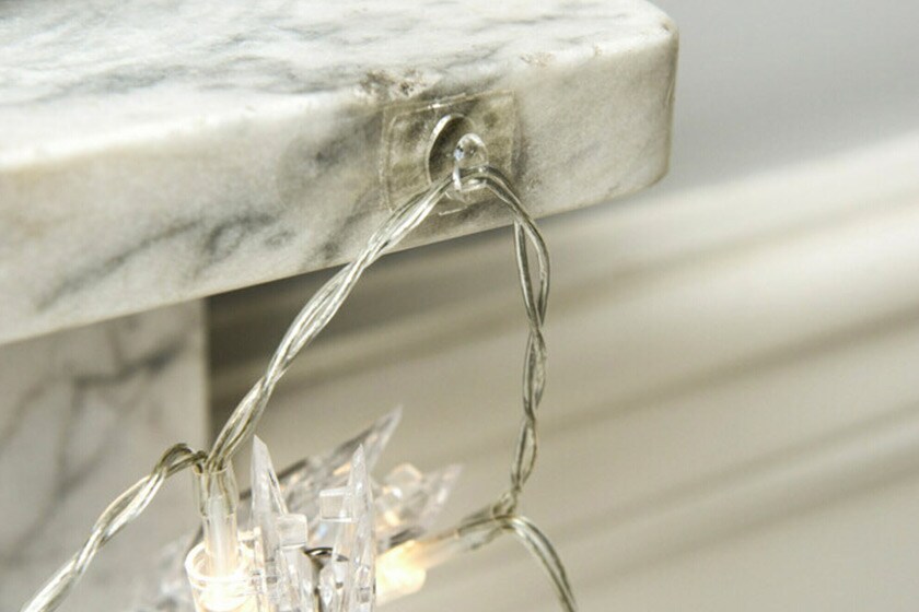 Command™ clear hook hanging a christmas decoration

